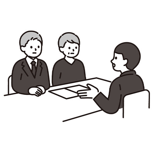 会議をしている3人の人物